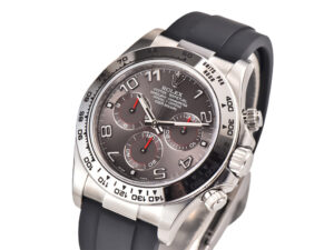 Cosmograph Daytona White Gold Oysterflex with Grey Racing Dial, featuring a black strap and detailed chronograph subdials.