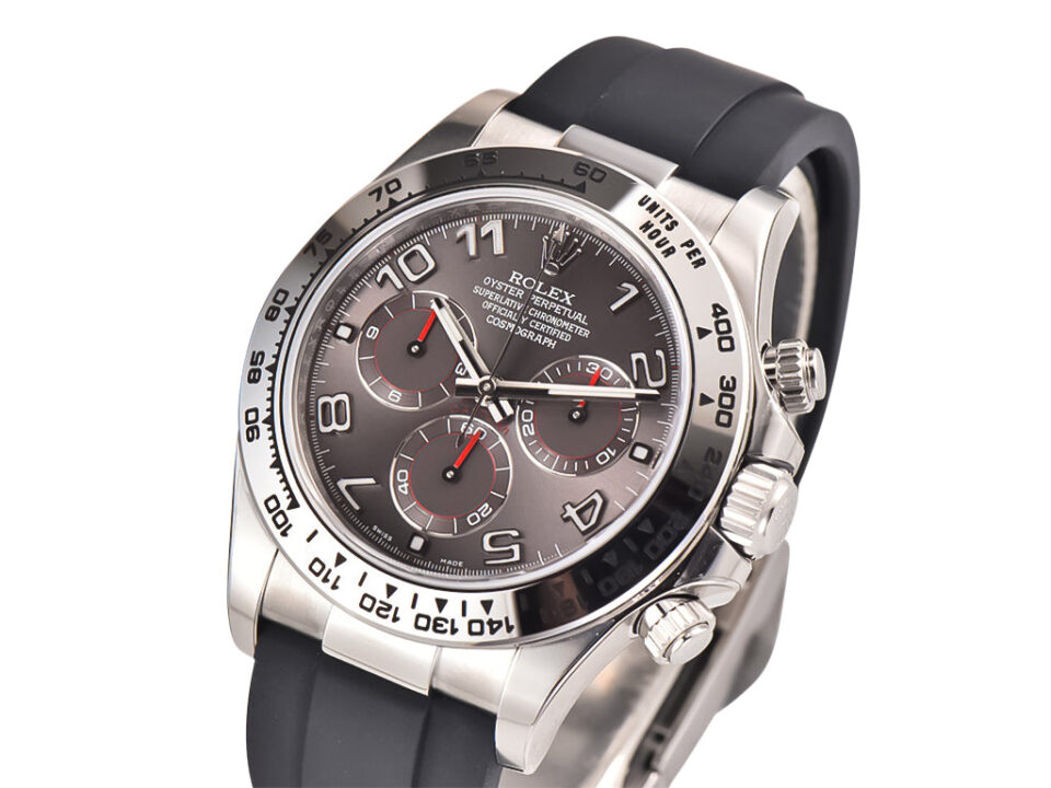 Cosmograph Daytona White Gold Oysterflex with Grey Racing Dial, featuring a black strap and detailed chronograph subdials.