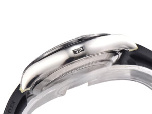 Side view of the Cosmograph Daytona White Gold Oysterflex watch with a focus on its polished case and black strap.