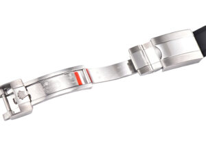 Close-up of the white gold Oysterflex clasp detailing on the Cosmograph Daytona with a grey racing dial.