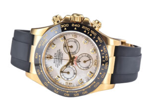 Cosmograph Daytona in yellow gold with Oysterflex strap, featuring a white mother-of-pearl dial and diamond hour markers.