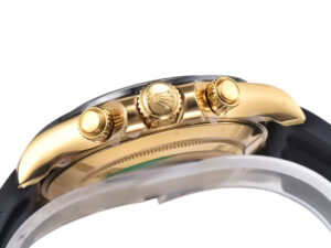 Side view of Cosmograph Daytona Yellow Gold Oysterflex watch, showcasing its golden crown and pushers against a black strap.