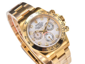 Cosmograph Daytona Yellow Gold Oysterflex with White Mother of Pearl Dial, showcasing diamond hour markers and gold accents.