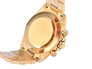 Back view of the Cosmograph Daytona Yellow Gold Oysterflex, showcasing its polished gold case back and side controls.
