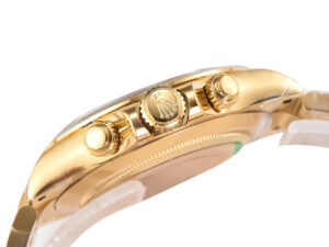Side view of the Cosmograph Daytona Yellow Gold Oysterflex with White Mother of Pearl Dial showing gold crown and pushers.