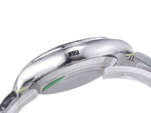 Side view of the Cosmograph Daytona White Gold case with polished finish and crown detail, highlighting its sleek design.
