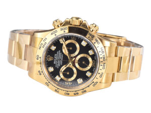 Cosmograph Daytona Yellow Gold watch with a black dial, diamond hour markers, and an elegant gold bracelet.