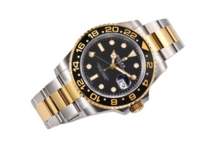 GMT-Master II Two-Tone Rolesor watch with black dial, gold and silver Oyster bracelet, 40mm case displayed at an angle.