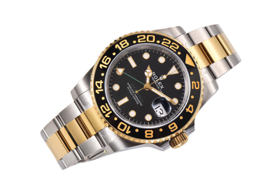 GMT-Master II Two-Tone Rolesor watch with black dial, gold and silver Oyster bracelet, 40mm case displayed at an angle.