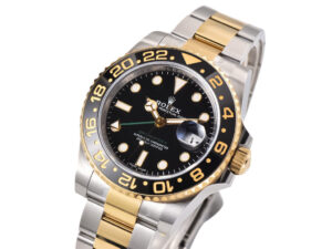 GMT-Master II Two-Tone Rolesor with black dial on Oyster bracelet, 40mm case, featuring gold accents and a ceramic bezel.