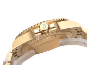 Side view of the GMT-Master II Yellow Gold with Black Dial on Jubilee (40mm), showcasing its crown and polished gold finish.