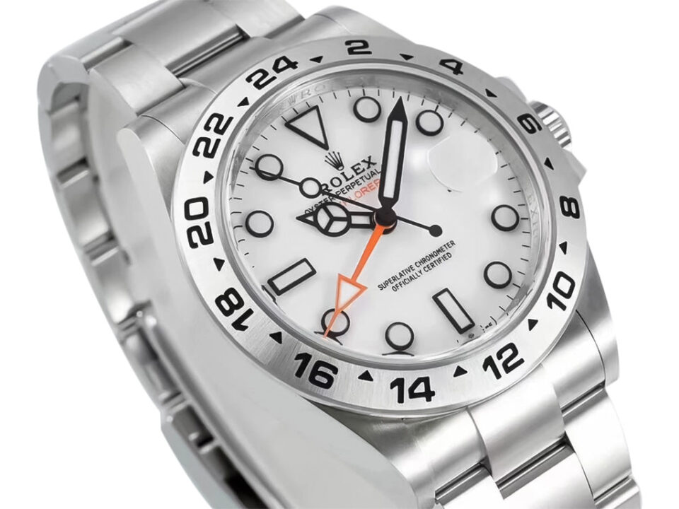 Explorer II Stainless Steel 'Polar' watch with a 42mm white dial, black hour markers, and orange GMT hand.