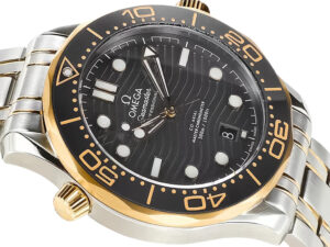 Seamaster Diver 300 Two Tone with Black Dial (42mm), stainless and gold case, wave pattern dial, date display at 6 o'clock.