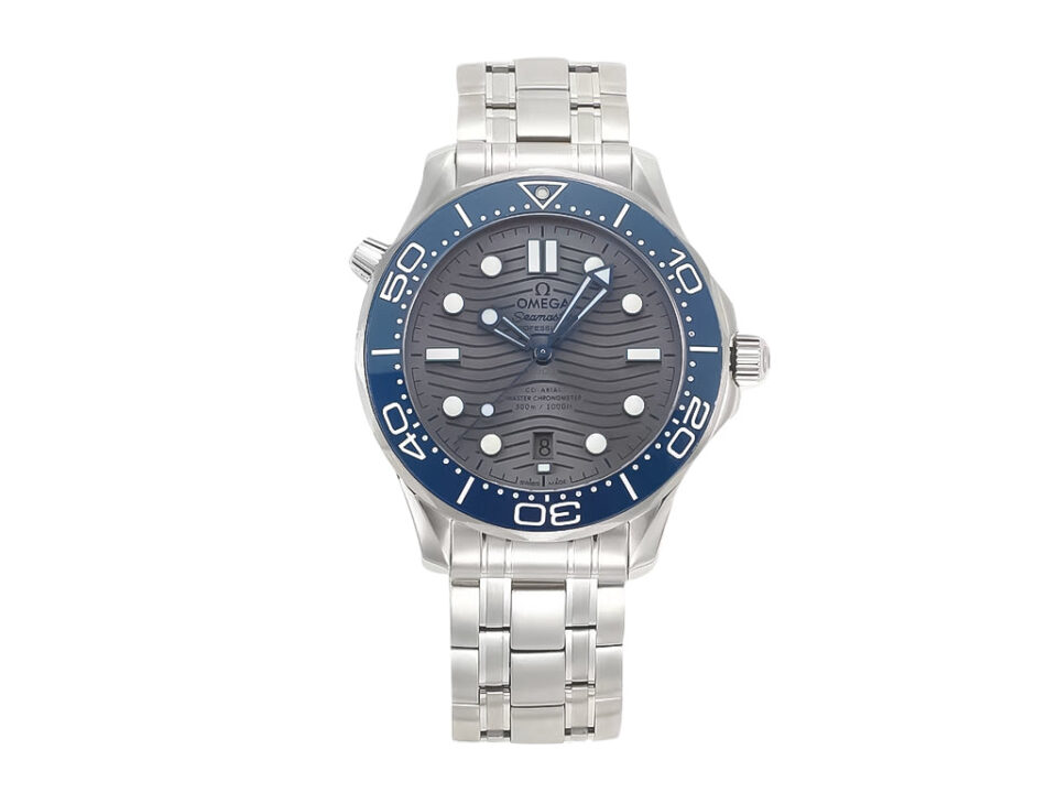 Stainless steel Seamaster Diver 300 watch, silver wavy-pattern dial, blue ceramic bezel, 42mm case on a metal bracelet.