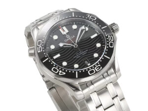 Seamaster Diver 300, 42mm stainless watch with black dial, wave pattern, unidirectional rotating bezel displayed up close.