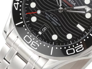 Close-up of Seamaster Diver 300 Stainless watch with black wave-patterned dial, white markers, date display at 6 o'clock.