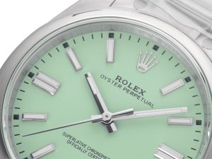 Close-up of Oyster Perpetual 41 Stainless Steel watch with pistachio green dial, silver hour markers, and hands.