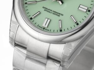 Close-up of Oyster Perpetual 36 Stainless Steel with pistachio dial, showing brushed bracelet and markers.