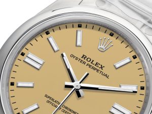 Close-up of Oyster Perpetual 41 Stainless Steel watch with beige dial, black hour markers, and silver hands.